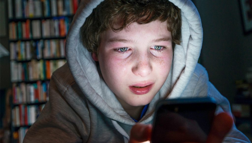 cuber bullying, victim, young boy, sad
